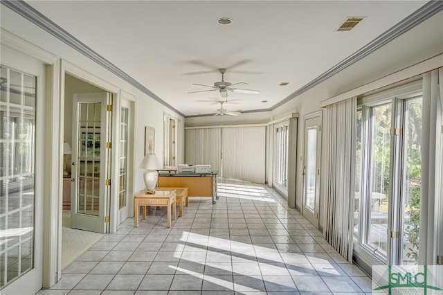 sunroom / solarium with ceiling fan