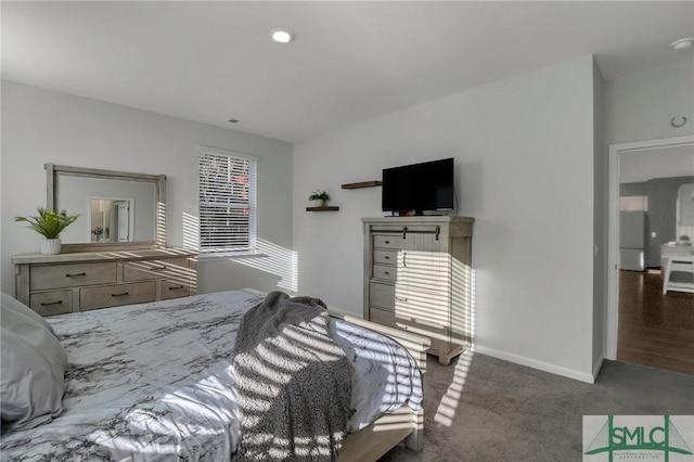 carpeted bedroom with white refrigerator