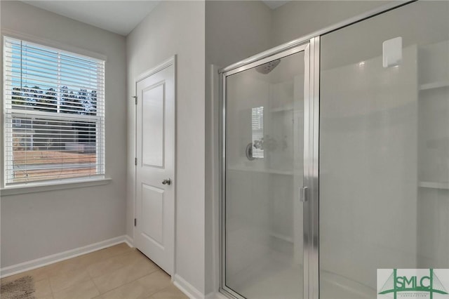 bathroom featuring tile patterned floors and walk in shower