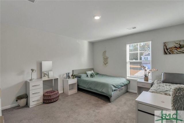 bedroom with light colored carpet