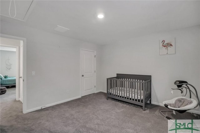 bedroom with light carpet and a nursery area