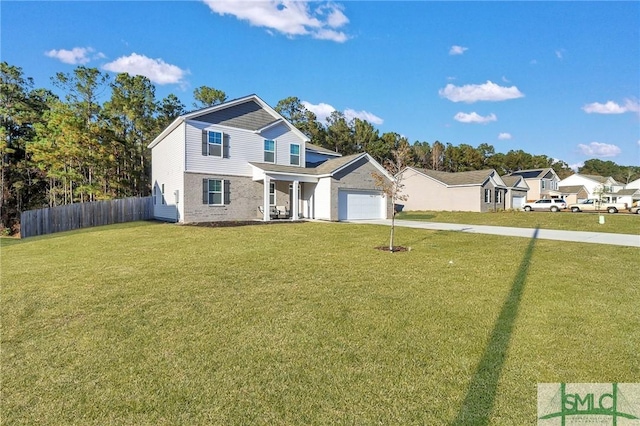 view of front facade featuring a front yard and a garage