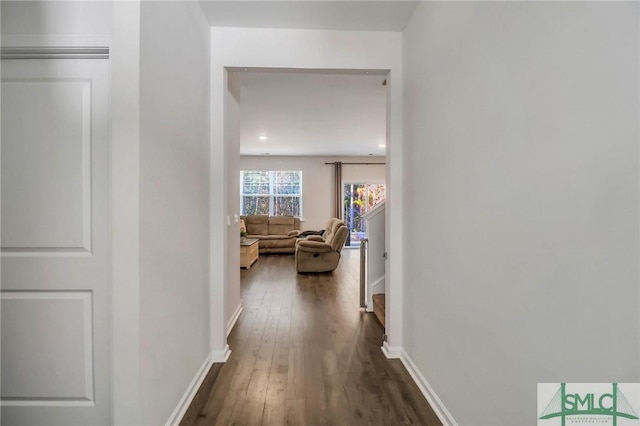 hall with dark hardwood / wood-style floors