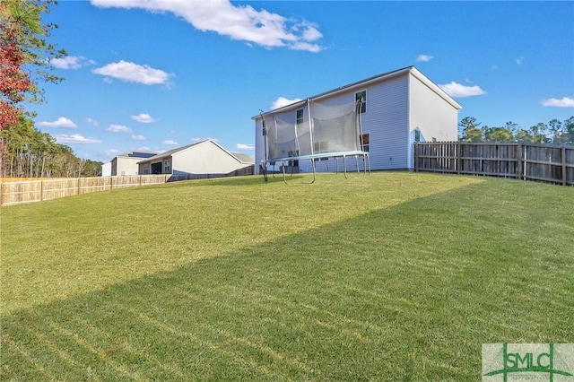 view of yard featuring a trampoline