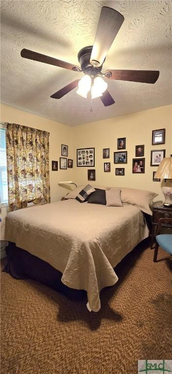 bedroom featuring ceiling fan, carpet flooring, and a textured ceiling