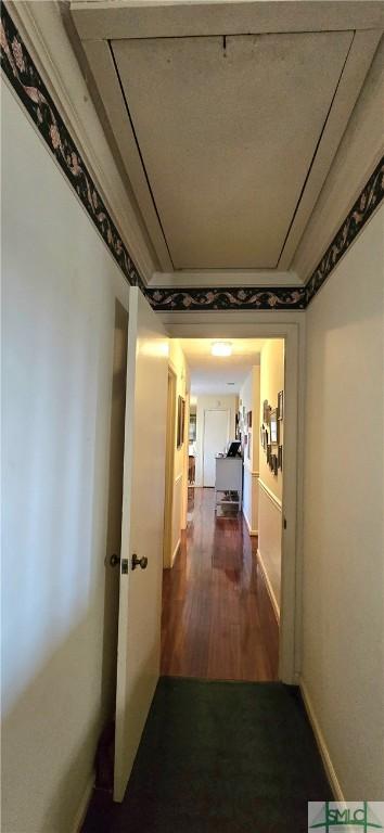 corridor featuring dark hardwood / wood-style floors