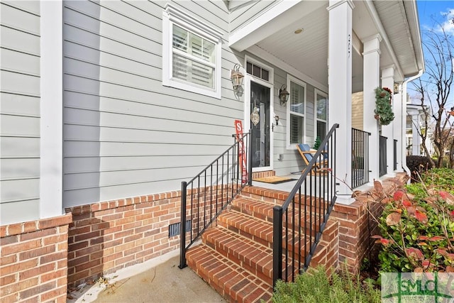 doorway to property featuring a porch