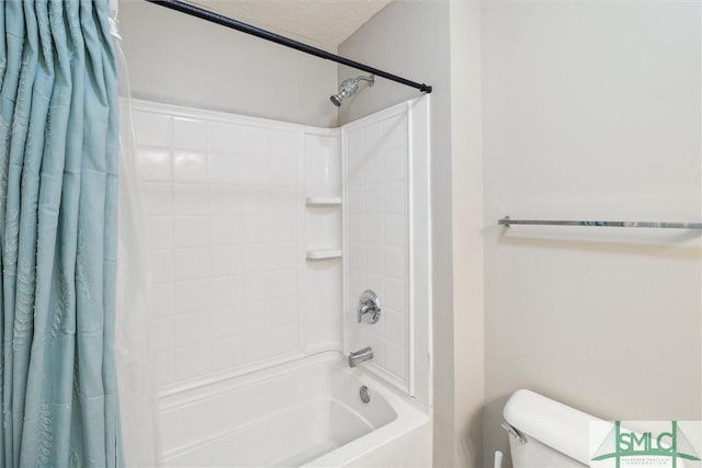 bathroom featuring toilet, a textured ceiling, and shower / tub combo