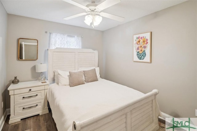 bedroom with ceiling fan and dark hardwood / wood-style flooring