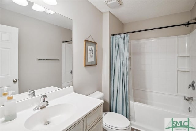 full bathroom featuring a textured ceiling, toilet, vanity, and shower / tub combo with curtain