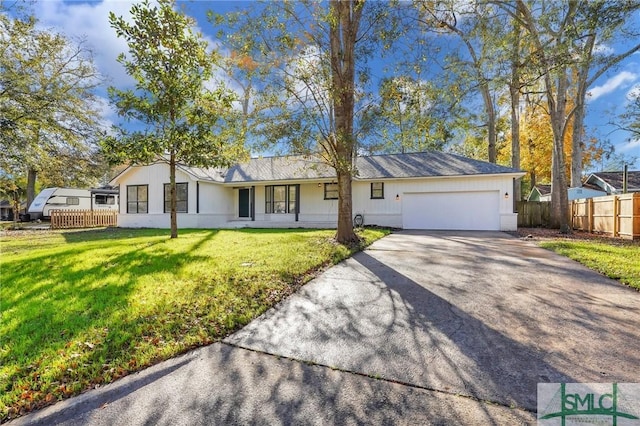 ranch-style house with a garage and a front lawn