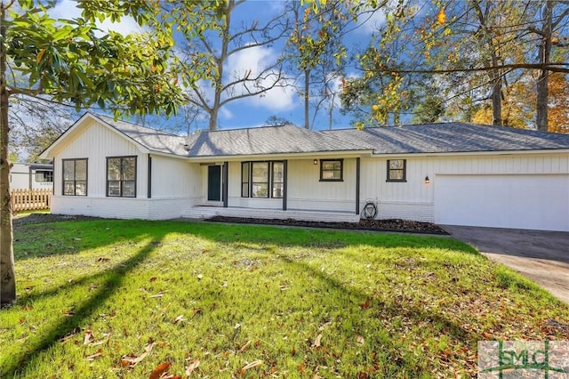 ranch-style house with a front yard and a garage