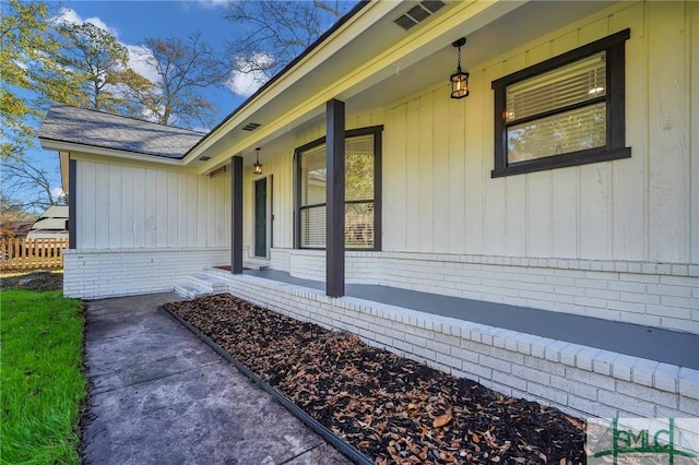 view of property exterior featuring covered porch