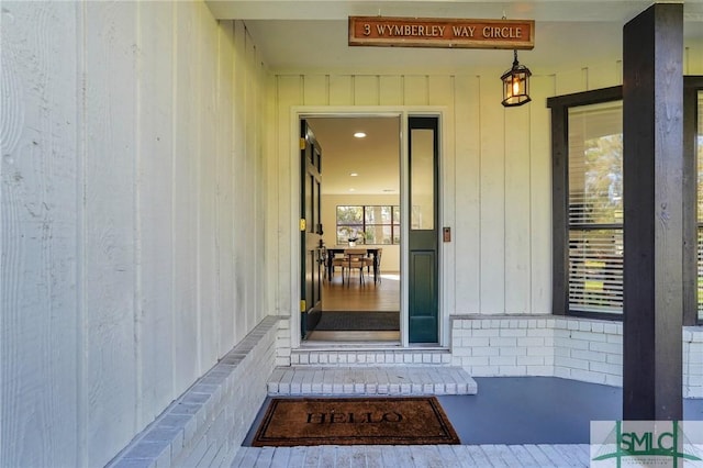 doorway to property featuring covered porch