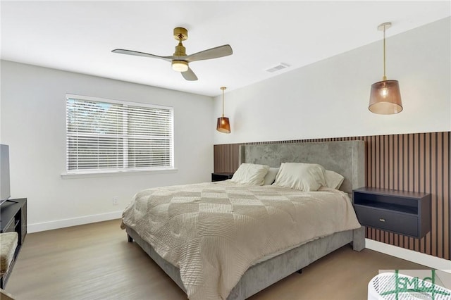 bedroom featuring ceiling fan and wood-type flooring