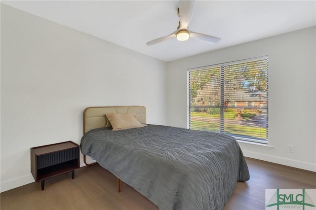 bedroom featuring wood-type flooring and ceiling fan