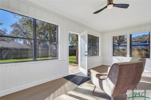 sunroom / solarium with ceiling fan