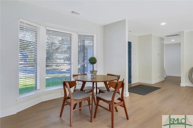 dining area featuring light wood-type flooring