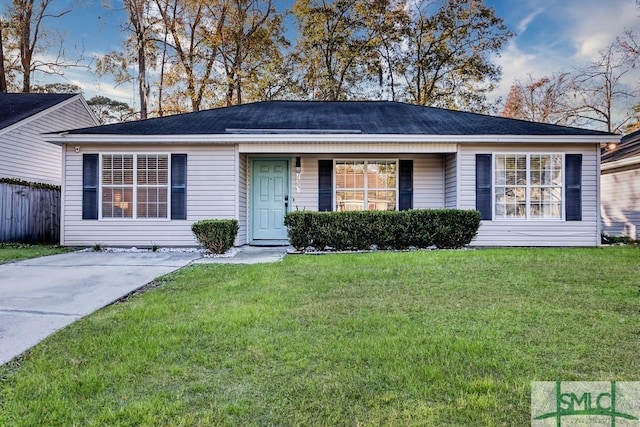 ranch-style home featuring a front yard