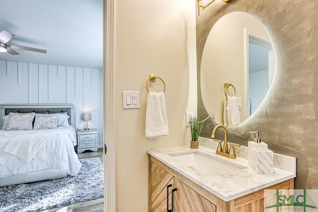 bathroom featuring ceiling fan and vanity