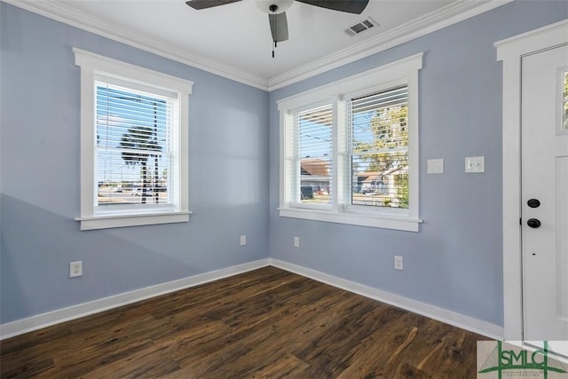 interior space with plenty of natural light, dark hardwood / wood-style floors, ornamental molding, and ceiling fan