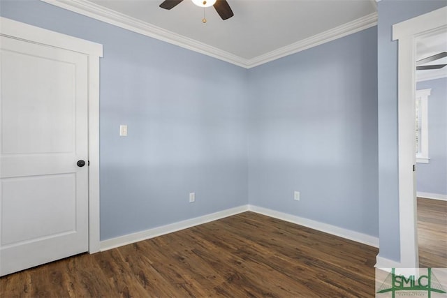 spare room with crown molding, ceiling fan, and dark wood-type flooring