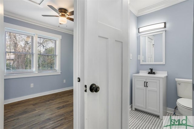 bathroom with vanity, hardwood / wood-style flooring, toilet, and crown molding