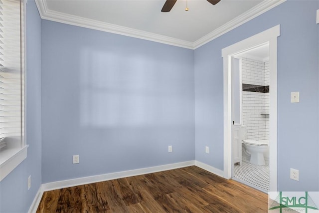 unfurnished bedroom with ceiling fan, dark hardwood / wood-style flooring, ornamental molding, and connected bathroom