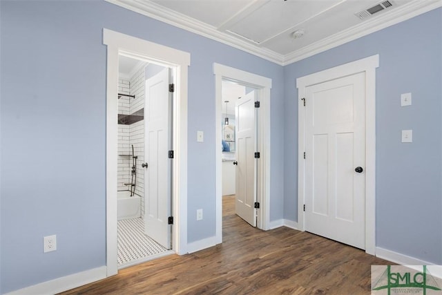 interior space with crown molding and dark hardwood / wood-style flooring