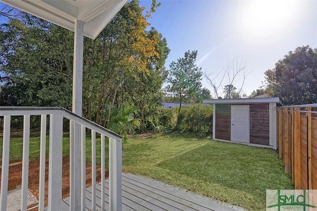 view of yard featuring a shed and a deck