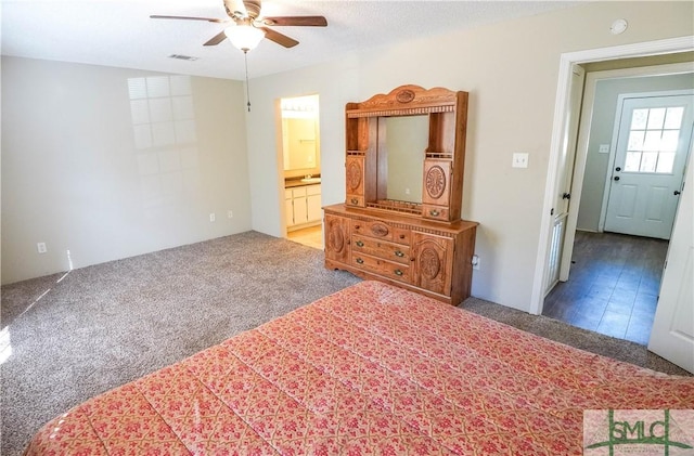 bedroom with connected bathroom, ceiling fan, and carpet