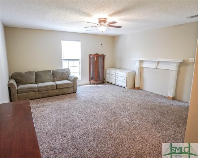 unfurnished living room with carpet, a textured ceiling, and ceiling fan