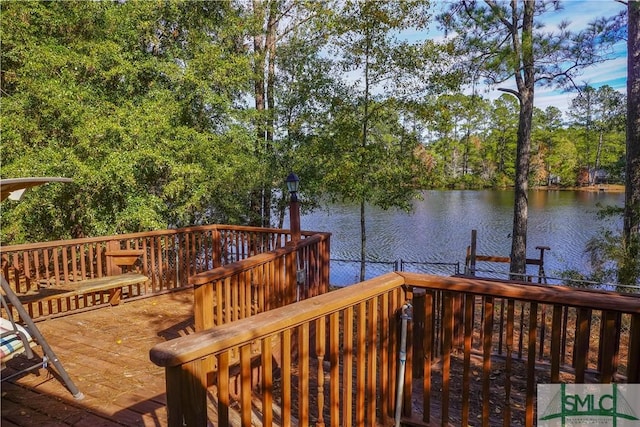 wooden deck with a water view