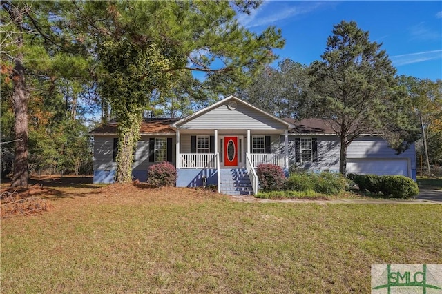 view of front of house featuring a porch, a garage, and a front lawn