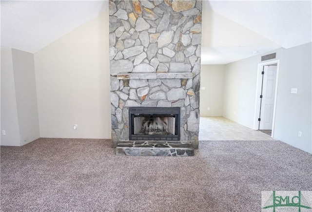 unfurnished living room with carpet flooring and a fireplace