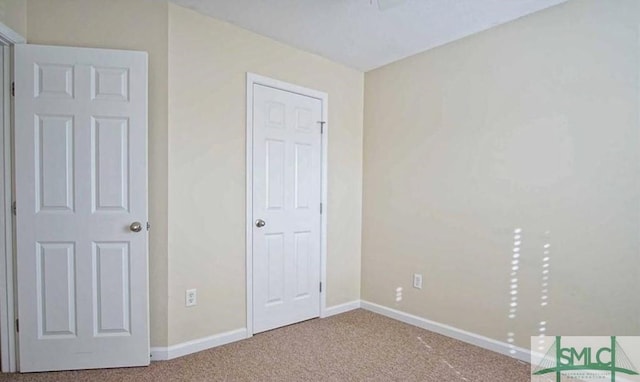 unfurnished bedroom with carpet flooring