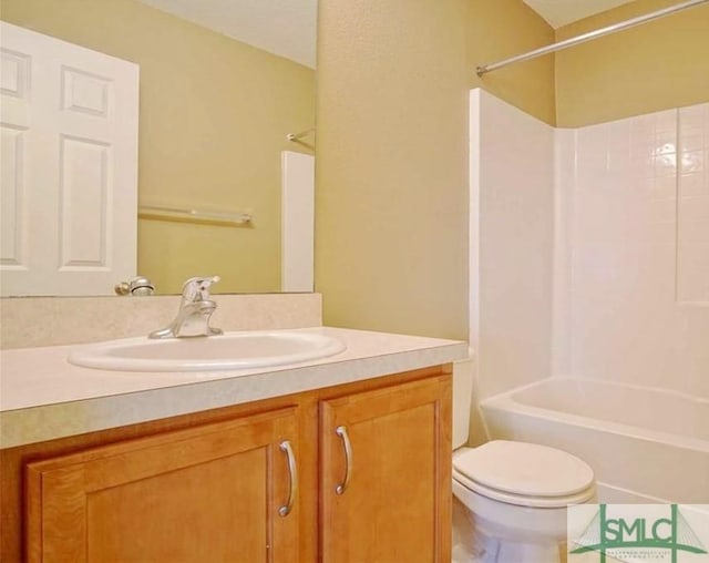 full bathroom featuring vanity, shower / bathtub combination, and toilet