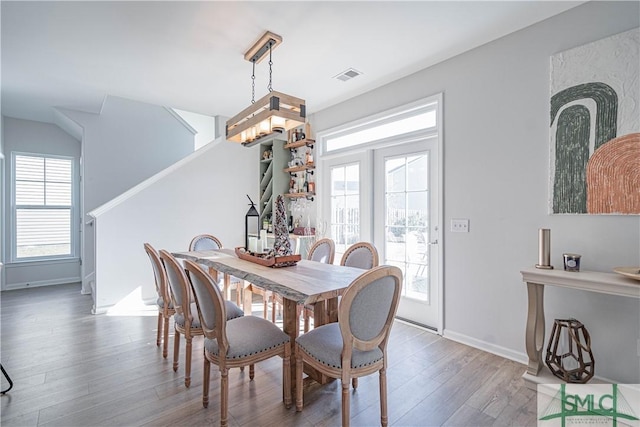 dining area with hardwood / wood-style flooring