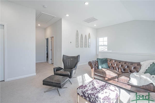 carpeted living room with vaulted ceiling