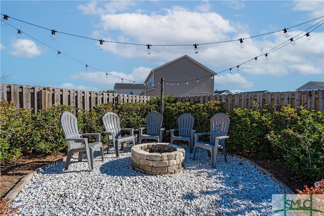 view of patio / terrace with an outdoor fire pit