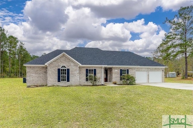 127 Winding Way Rd, Pembroke, GA 31321 - view of front of property with driveway, a garage, brick siding, a front lawn, and roof with shingles