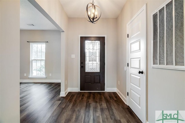 127 Winding Way Rd, Pembroke, GA 31321 - foyer entrance with a heating unit, dark wood-style flooring, and a chandelier