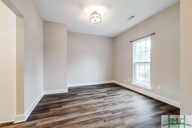 127 Winding Way Rd, Pembroke, GA 31321 - unfurnished room with dark wood-style floors and baseboards