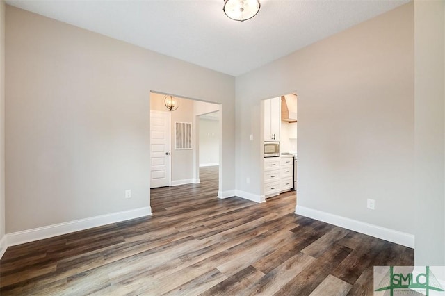 127 Winding Way Rd, Pembroke, GA 31321 - unfurnished bedroom with dark wood finished floors