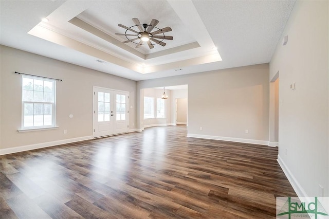 127 Winding Way Rd, Pembroke, GA 31321 - spare room featuring a tray ceiling, french doors, dark wood-style floors, a ceiling fan, and ornamental molding