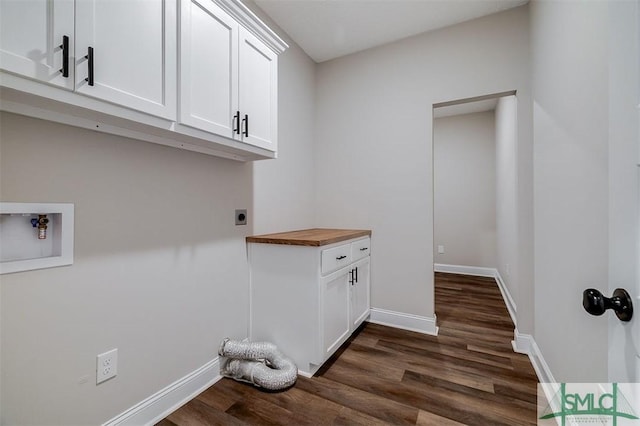 127 Winding Way Rd, Pembroke, GA 31321 - laundry room featuring electric dryer hookup, dark wood-style flooring, cabinet space, and hookup for a washing machine