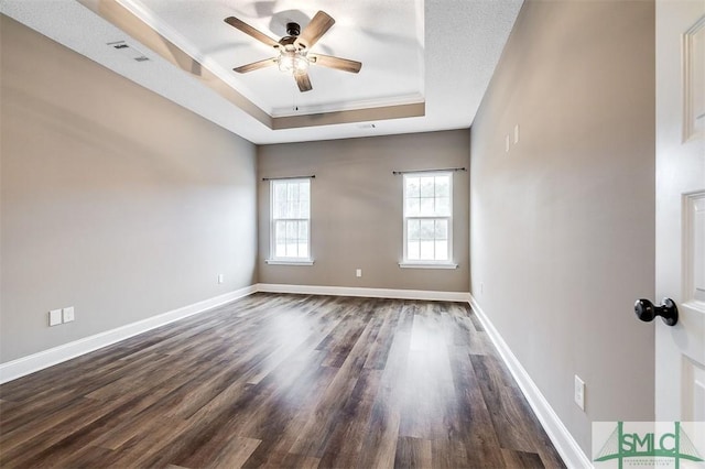 127 Winding Way Rd, Pembroke, GA 31321 - unfurnished room featuring a tray ceiling, a ceiling fan, dark wood-style flooring, and crown molding