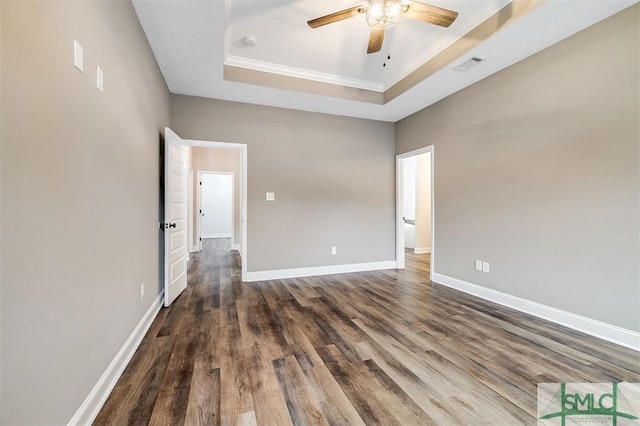 127 Winding Way Rd, Pembroke, GA 31321 - spare room with a ceiling fan, dark wood-style floors, a raised ceiling, ornamental molding, and a smoke detector