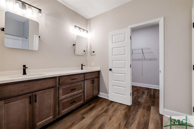 127 Winding Way Rd, Pembroke, GA 31321 - full bath with double vanity, wood finished floors, and a spacious closet