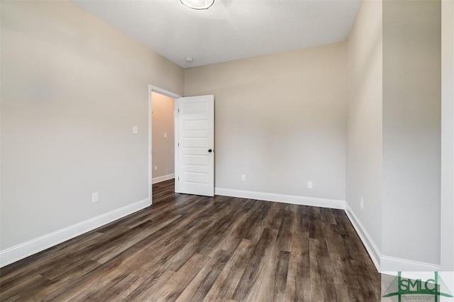 127 Winding Way Rd, Pembroke, GA 31321 - spare room featuring dark wood finished floors and a textured ceiling